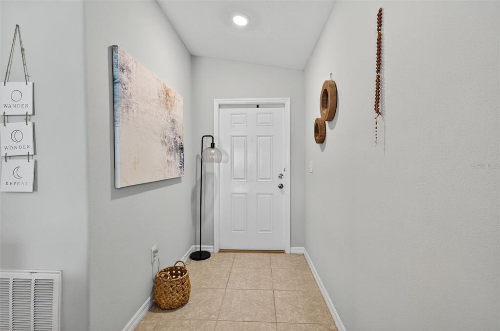 9645 Lemon Drop Loop Ruskin, FL 33573 - Photo 6 of 49 a bathroom with a tub and shower