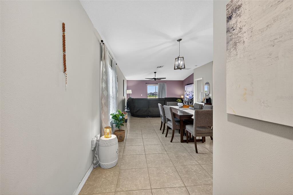 9645 Lemon Drop Loop Ruskin, FL 33573 - Photo 7 of 49 a kitchen with a sink and a stove top oven