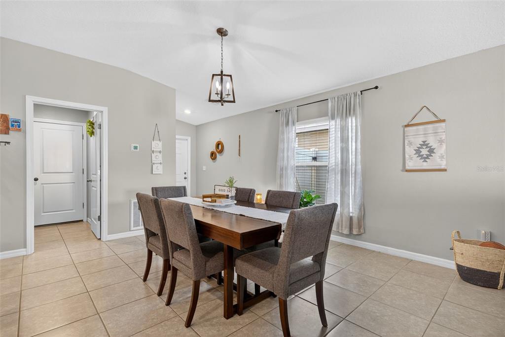 9645 Lemon Drop Loop Ruskin, FL 33573 - Photo 9 of 49 a view of a dining room with furniture