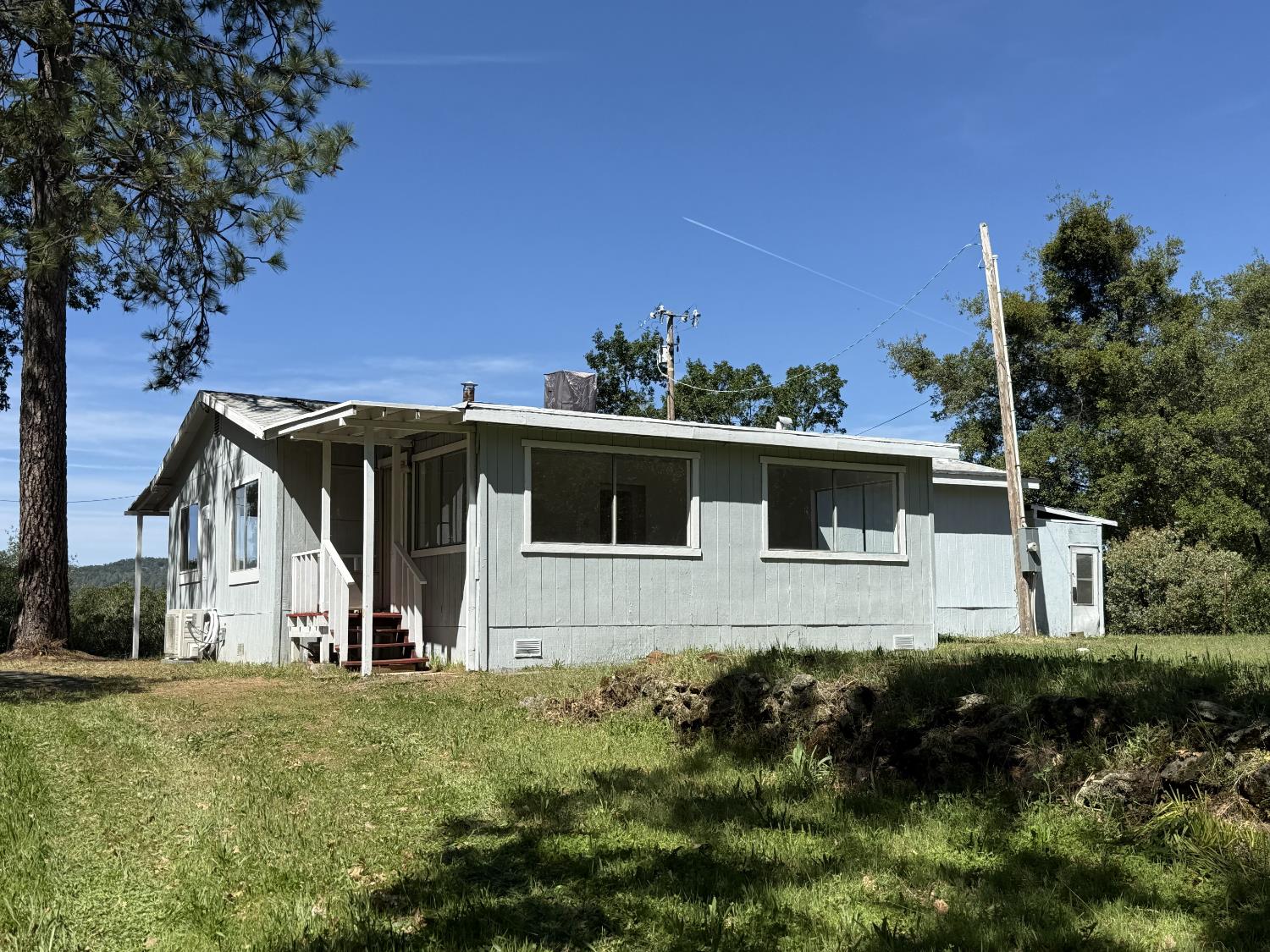 15679 Ware Lane Rackerby, CA 95972 - Photo 24 of 35 a front view of house with yard and trees in the background