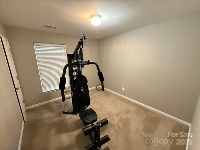 a view of a backyard with table and chairs