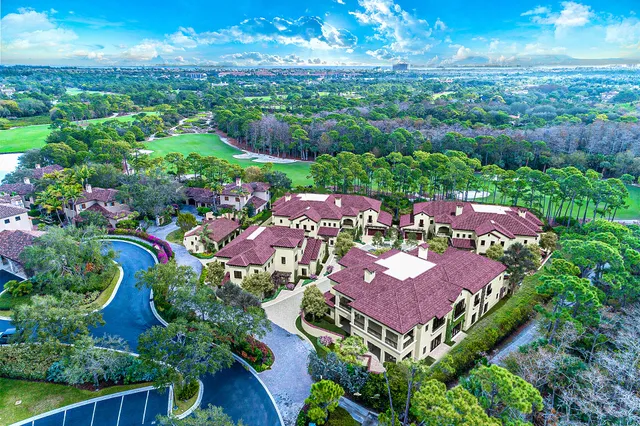an aerial view of residential houses with outdoor space and street view