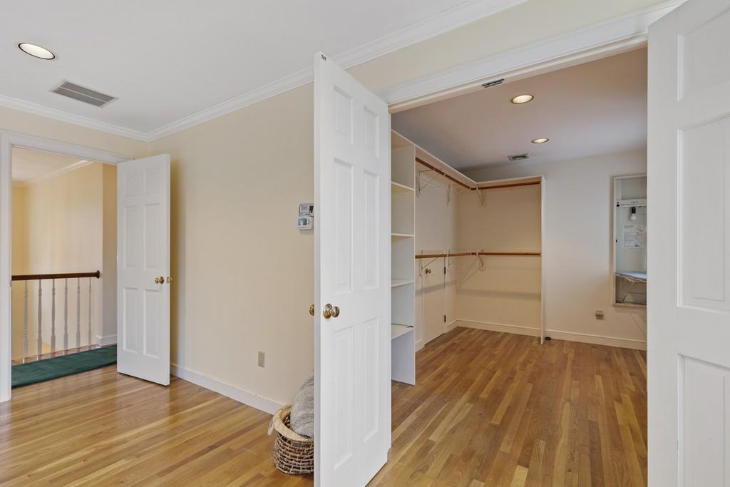 4 Sunset Ridge Lexington, MA 02421 - Photo 17 of 35 a view of a room with wooden floor and a hallway