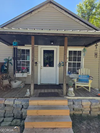 a front view of a house with porch