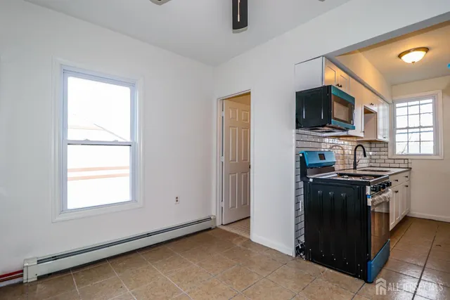 a kitchen with a stove and a microwave