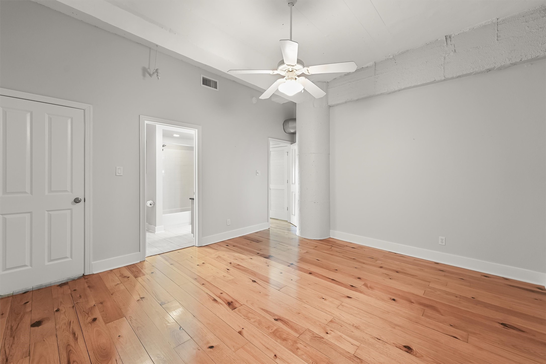 104 21st Street, Unit 203 Galveston, TX 77550 - Photo 15 of 27 a view of empty room with wooden floor