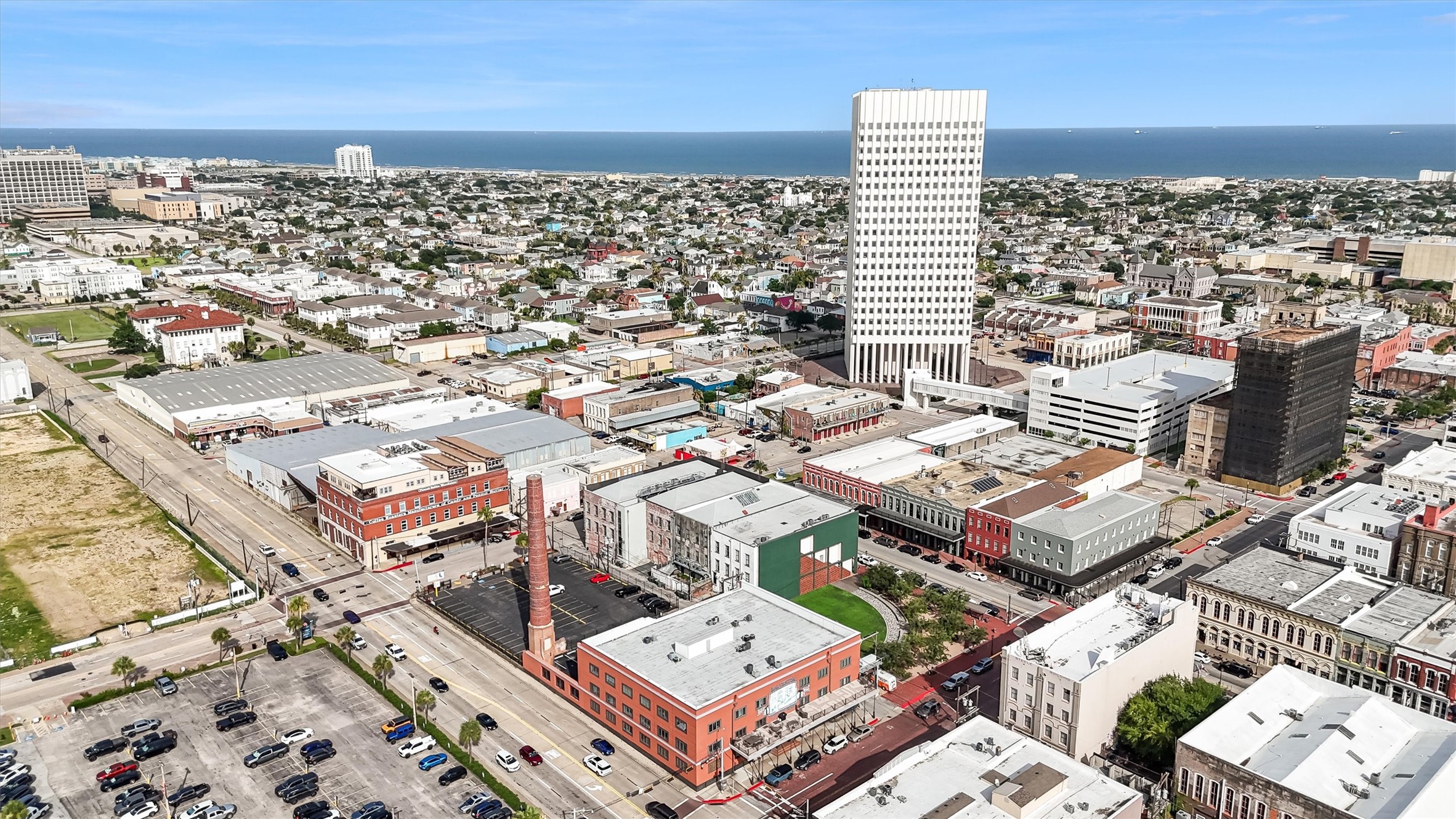 104 21st Street, Unit 203 Galveston, TX 77550 - Photo 24 of 27 an aerial view of a building with parking space