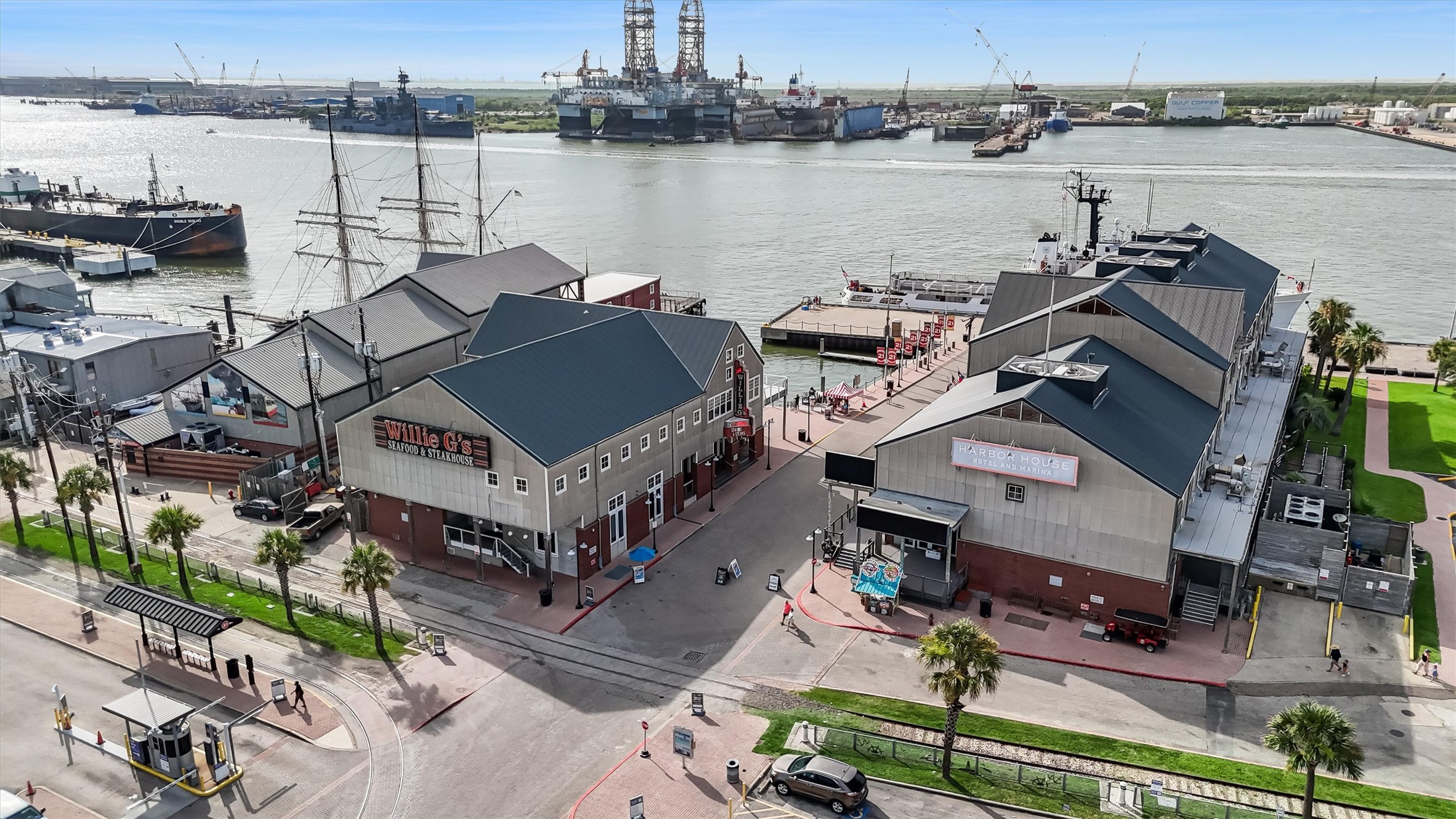 104 21st Street, Unit 203 Galveston, TX 77550 - Photo 27 of 27 an aerial view of a house with lake and houses