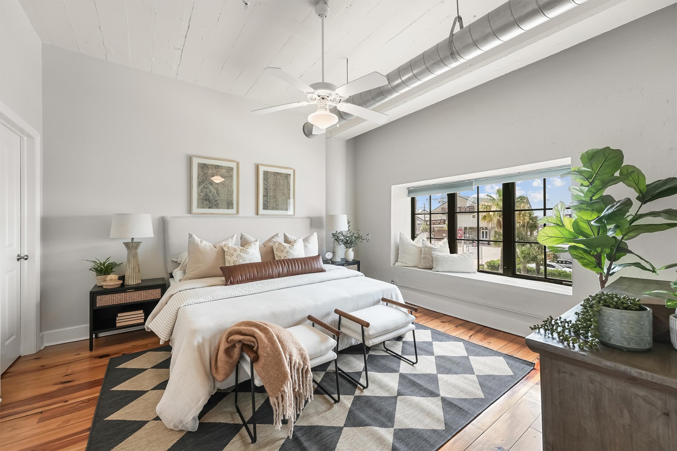 104 21st Street, Unit 203 Galveston, TX 77550 - Photo 10 of 27 a living room with furniture and a potted plant