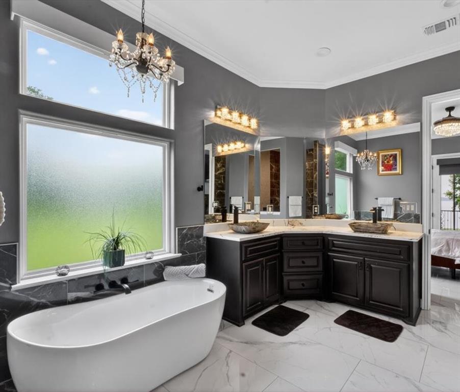 145 Private Road Pittsburg, TX 75686 - Photo 13 of 40 Primary Bathroom with Stand Alone Tub, Double Vanities