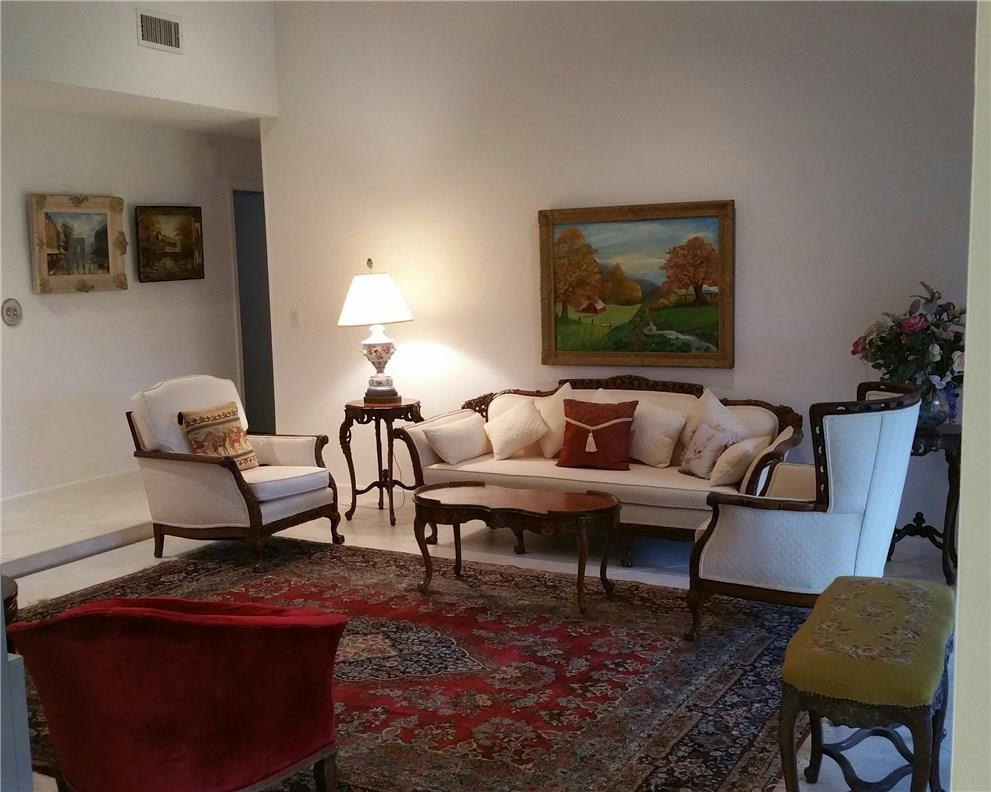 18108 102nd Way South Boca Raton, FL 33498 - Photo 3 of 21 a living room with furniture a rug and a lamp