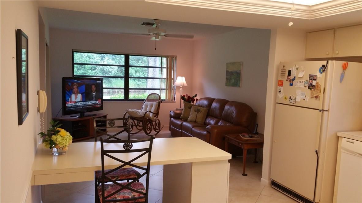 18108 102nd Way South Boca Raton, FL 33498 - Photo 7 of 21 a view of a dining room with furniture window and outside view