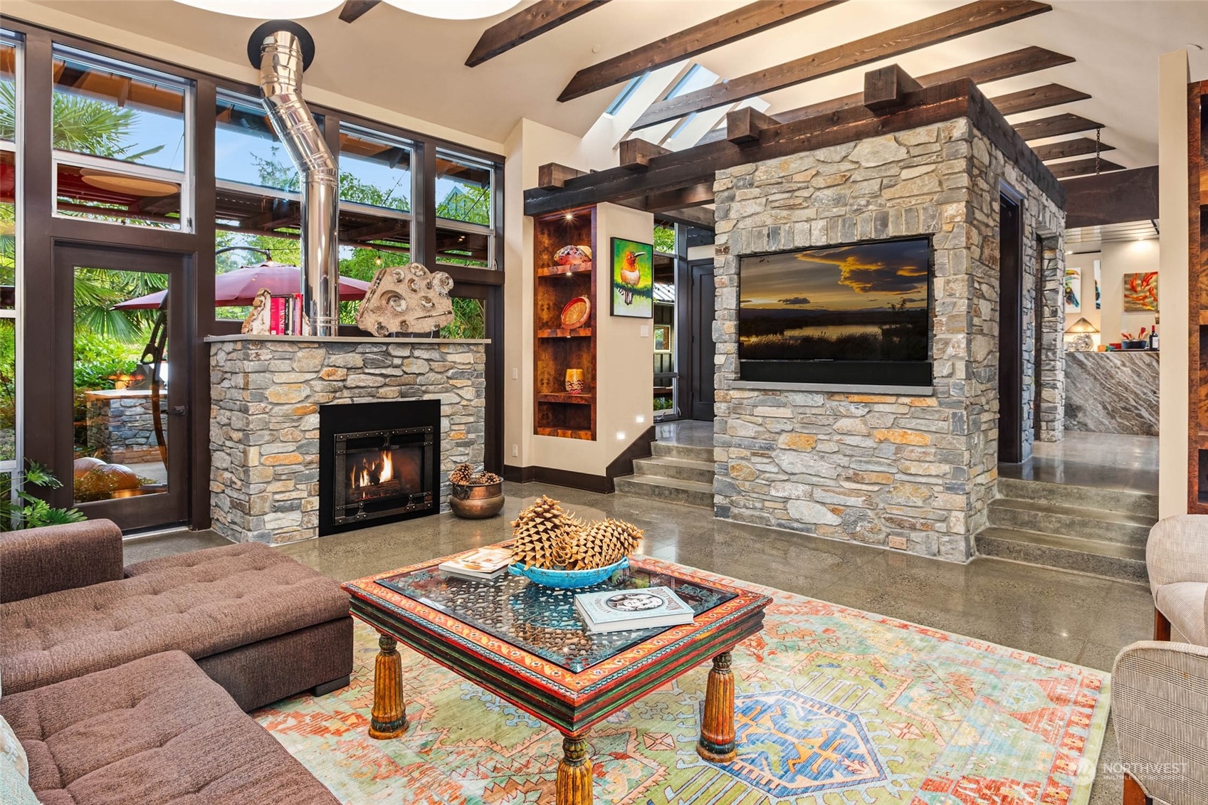 10618 Northeast 155th Place Bothell, WA 98011 - Photo 15 of 40 a living room with furniture a flat screen tv and a fireplace