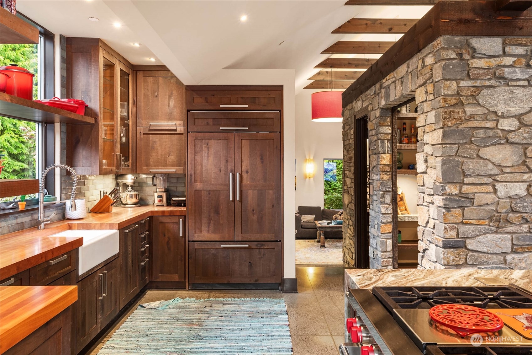 10618 Northeast 155th Place Bothell, WA 98011 - Photo 21 of 40 a kitchen with stainless steel appliances granite countertop a stove a sink and a refrigerator