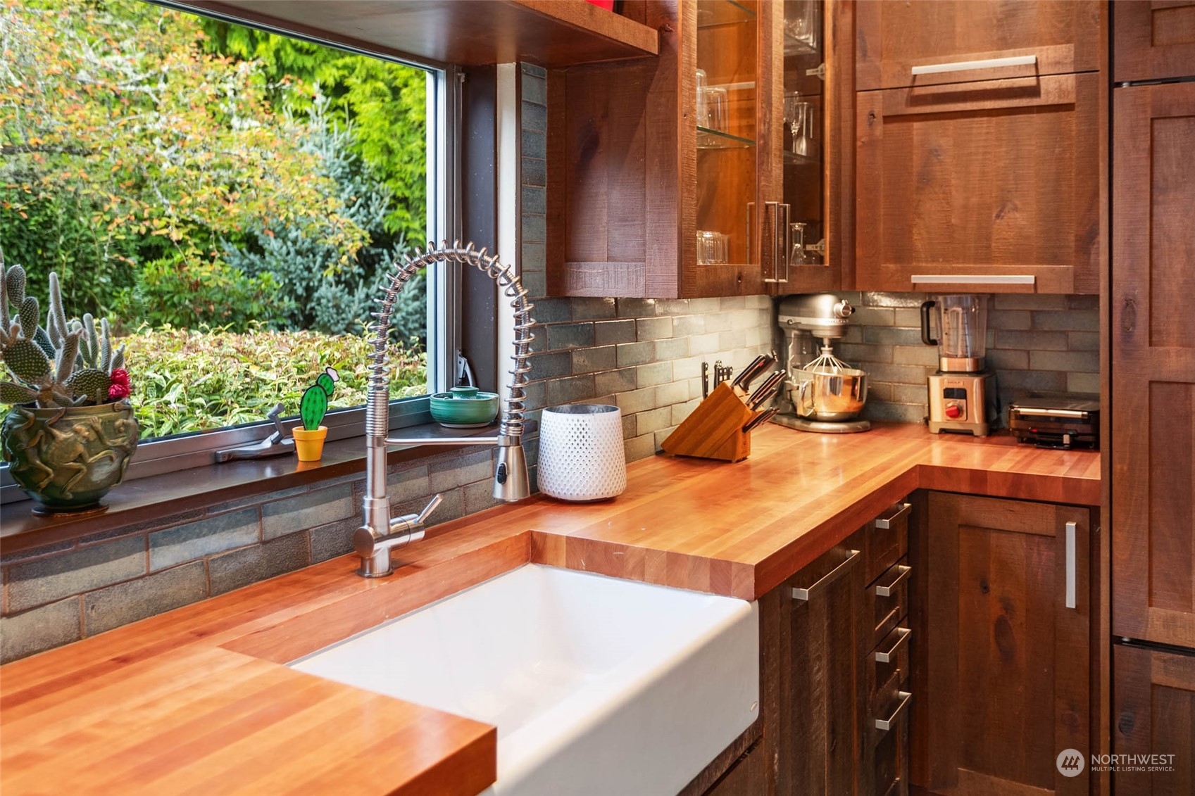 10618 Northeast 155th Place Bothell, WA 98011 - Photo 23 of 40 a kitchen with a sink a counter top space and living room