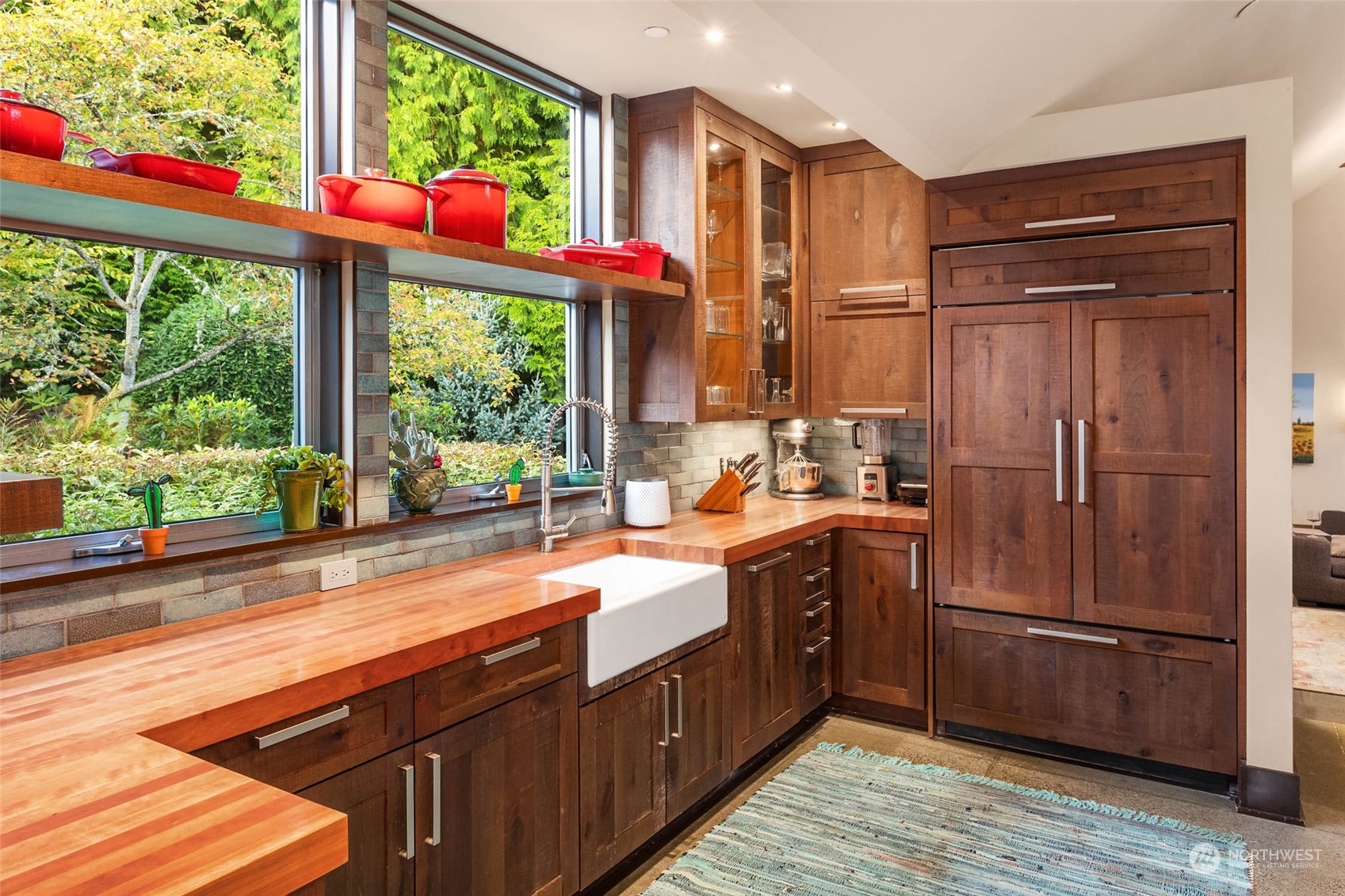10618 Northeast 155th Place Bothell, WA 98011 - Photo 24 of 40 a kitchen with stainless steel appliances granite countertop a refrigerator and a sink