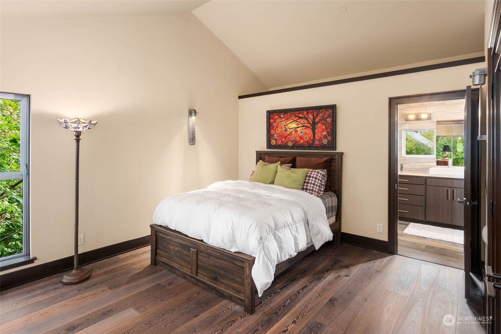 10618 Northeast 155th Place Bothell, WA 98011 - Photo 32 of 40 a bedroom with a bed and a painting on the wall