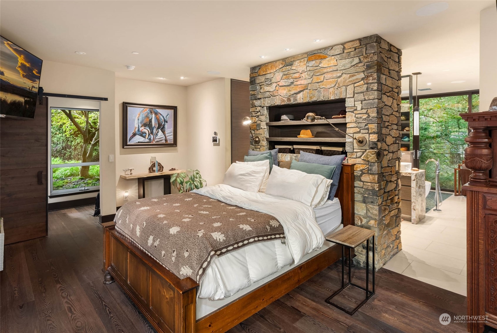 10618 Northeast 155th Place Bothell, WA 98011 - Photo 35 of 40 a bedroom with a bed and a flat screen tv