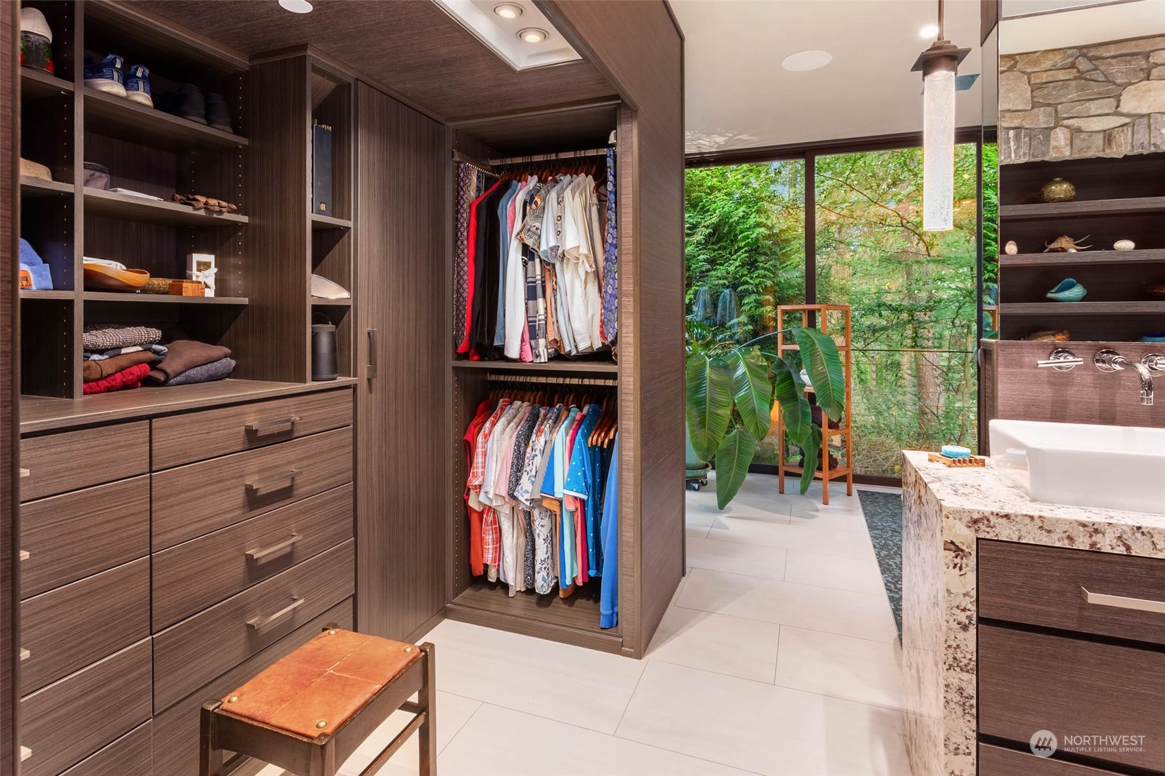 10618 Northeast 155th Place Bothell, WA 98011 - Photo 37 of 40 walk in closet with clothes and shoes