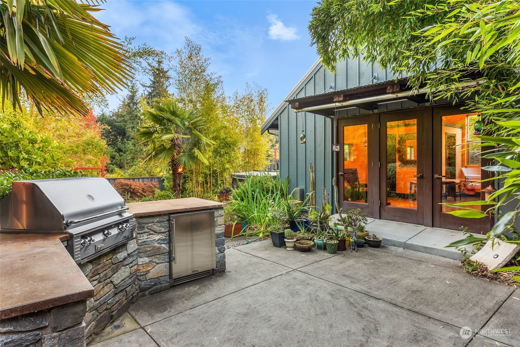 10618 Northeast 155th Place Bothell, WA 98011 - Photo 8 of 40 a view of a patio with table and chairs and potted plants