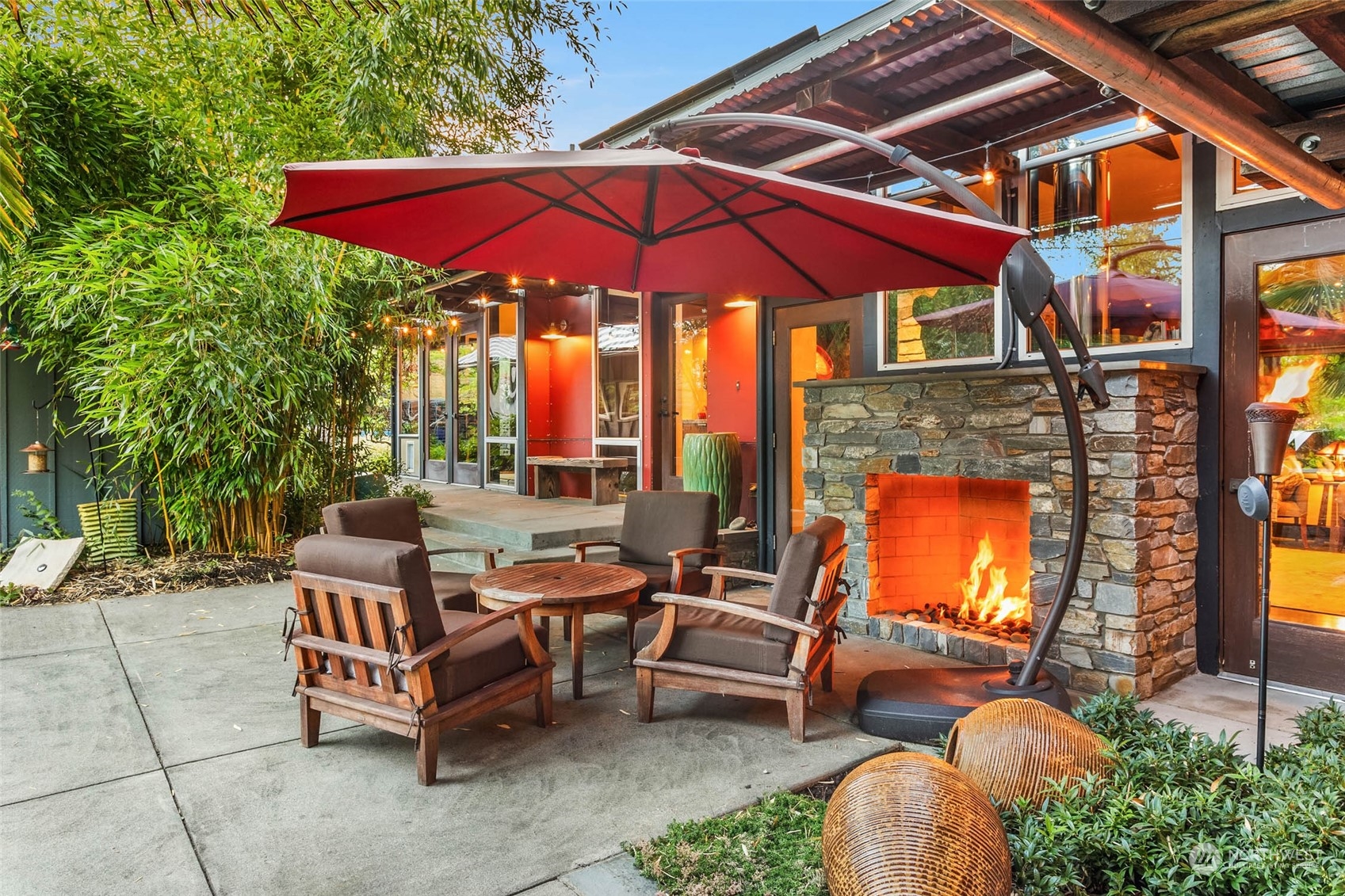 10618 Northeast 155th Place Bothell, WA 98011 - Photo 9 of 40 a backyard of a house with fire pit and outdoor seating