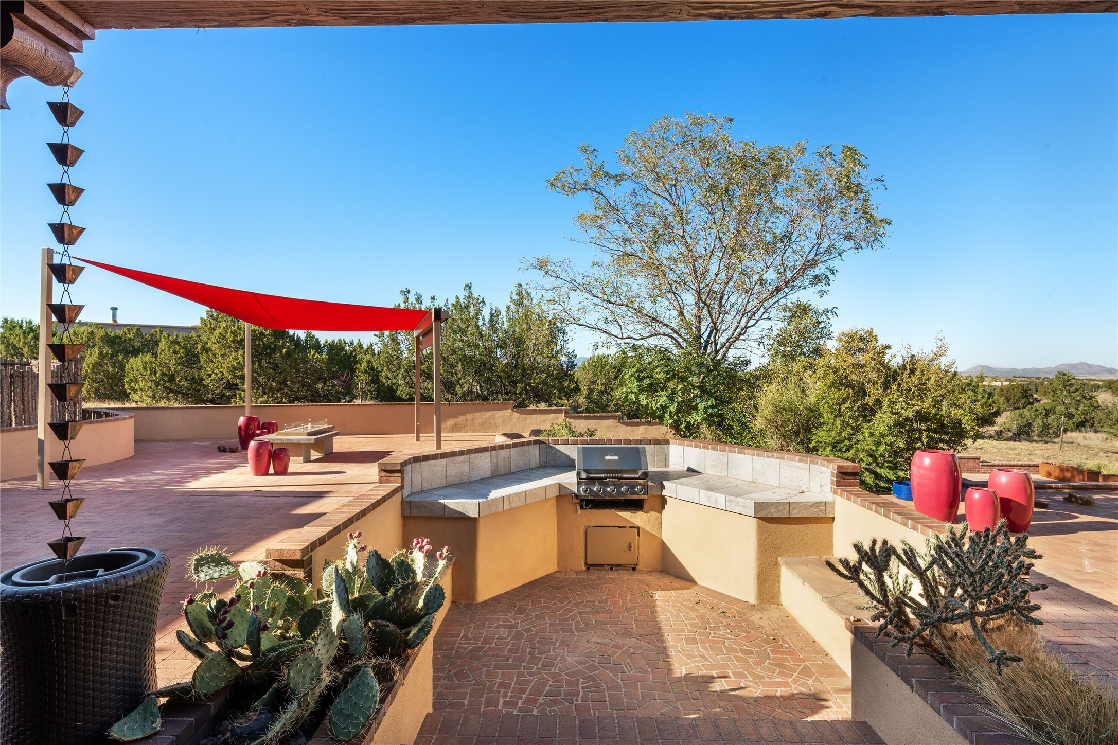Back patio, fire table and BBQ area with seating.