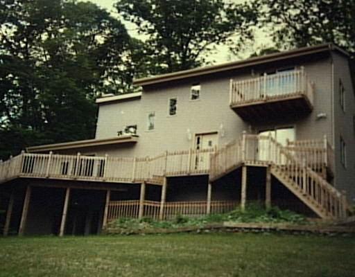 a view of house with roof deck