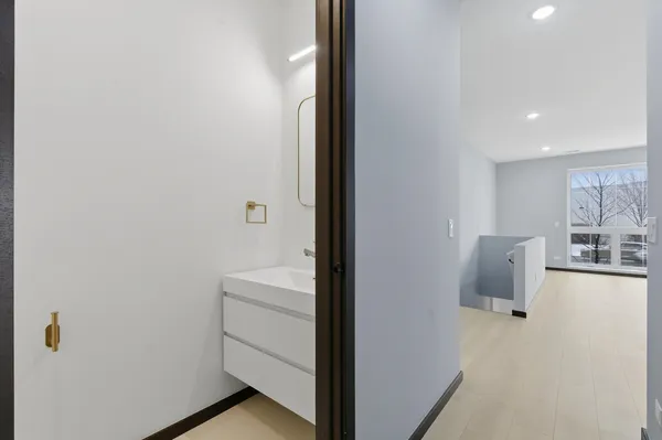 a view of a kitchen from the hallway
