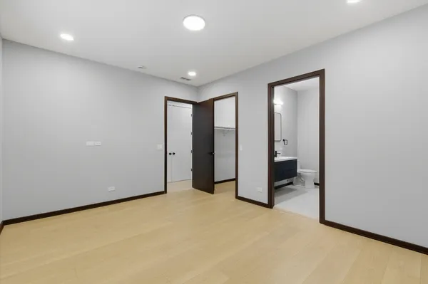 a bathroom with a double vanity sink and a toilet