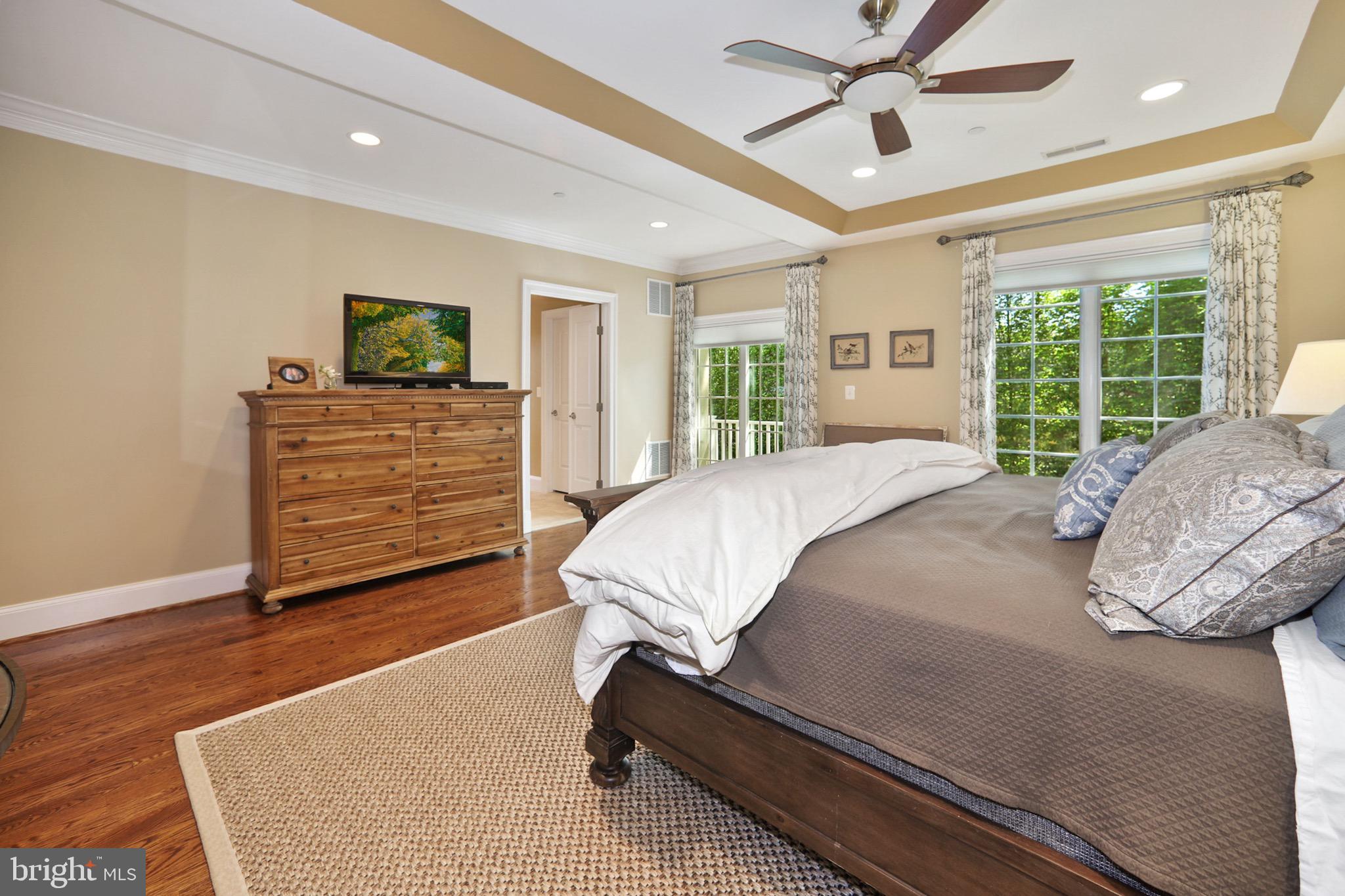 7117 Exfair Road Bethesda, MD 20814 - Photo 21 of 42 a bed sitting in a spacious bedroom next to a window