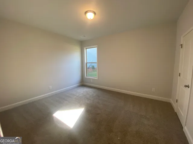 a view of a big house with a big yard