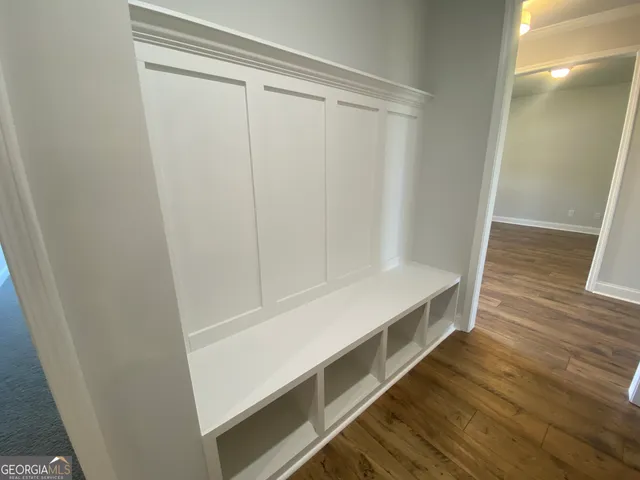 a large kitchen with kitchen island a sink stainless steel appliances and cabinets