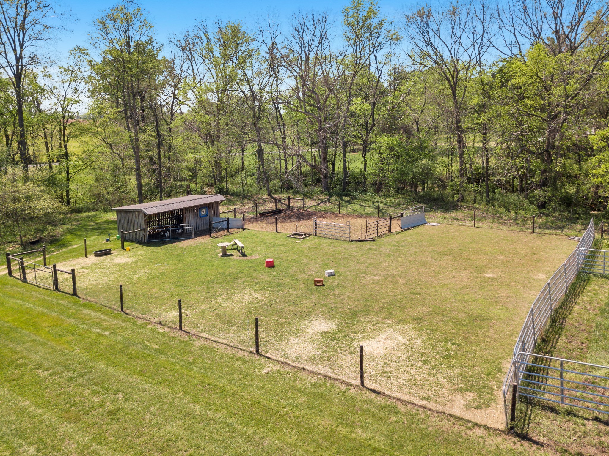 3988 Fykes Grove Road Cedar Hill, TN 37032 - Photo 10 of 50 a view of a swimming pool with a lawn chairs under an umbrella