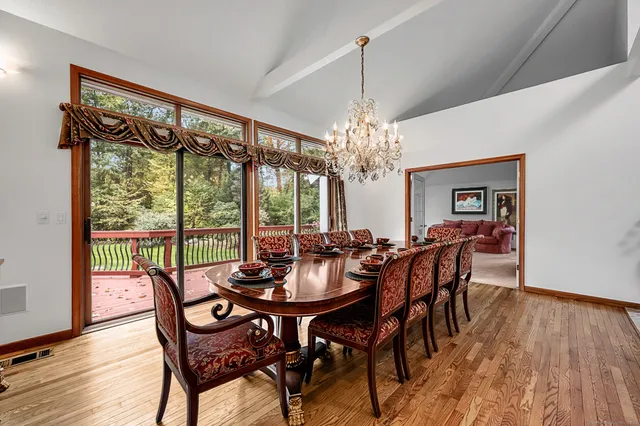 a living room with furniture and floor to ceiling window