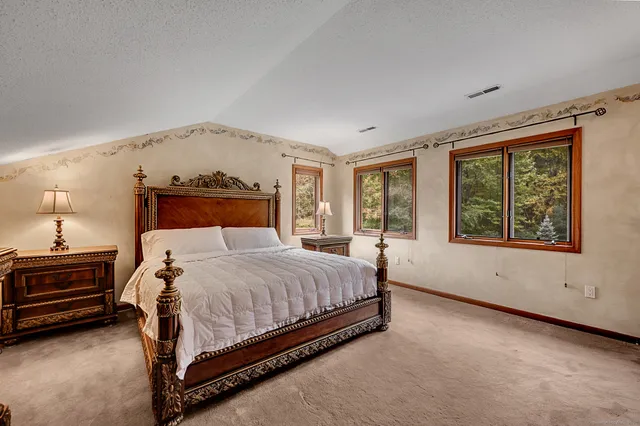 a bathroom with a shower and mirror