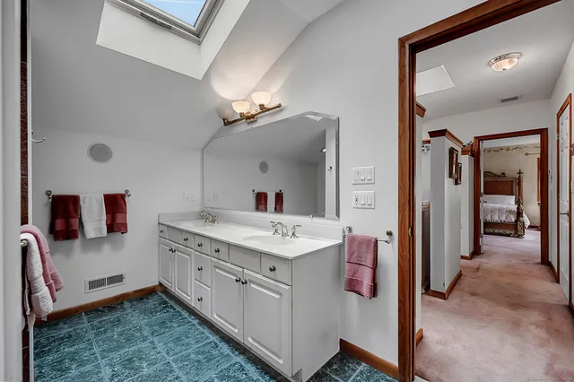 a balcony with wooden floor and yard in the back