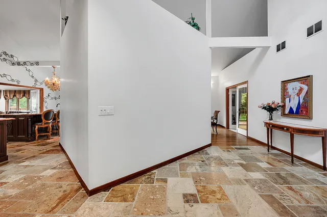 a kitchen with stainless steel appliances kitchen island granite countertop a stove and a sink