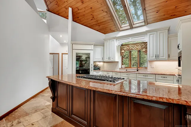 a view of a dining room and a table and chairs