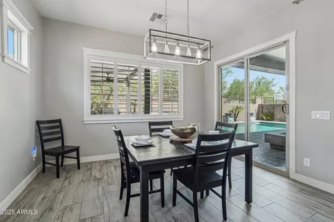 a view of a dining room with furniture window and outside view
