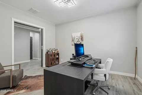 a workspace with furniture and wooden floor