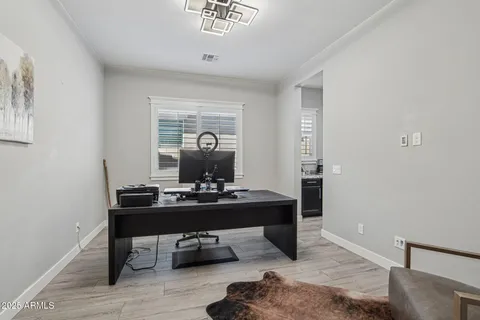 a view of a workspace with furniture