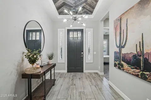 a view of a livingroom with furniture and hardwood floor