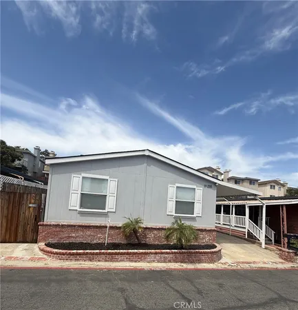 a kitchen with stainless steel appliances granite countertop a refrigerator a stove a sink and a microwave