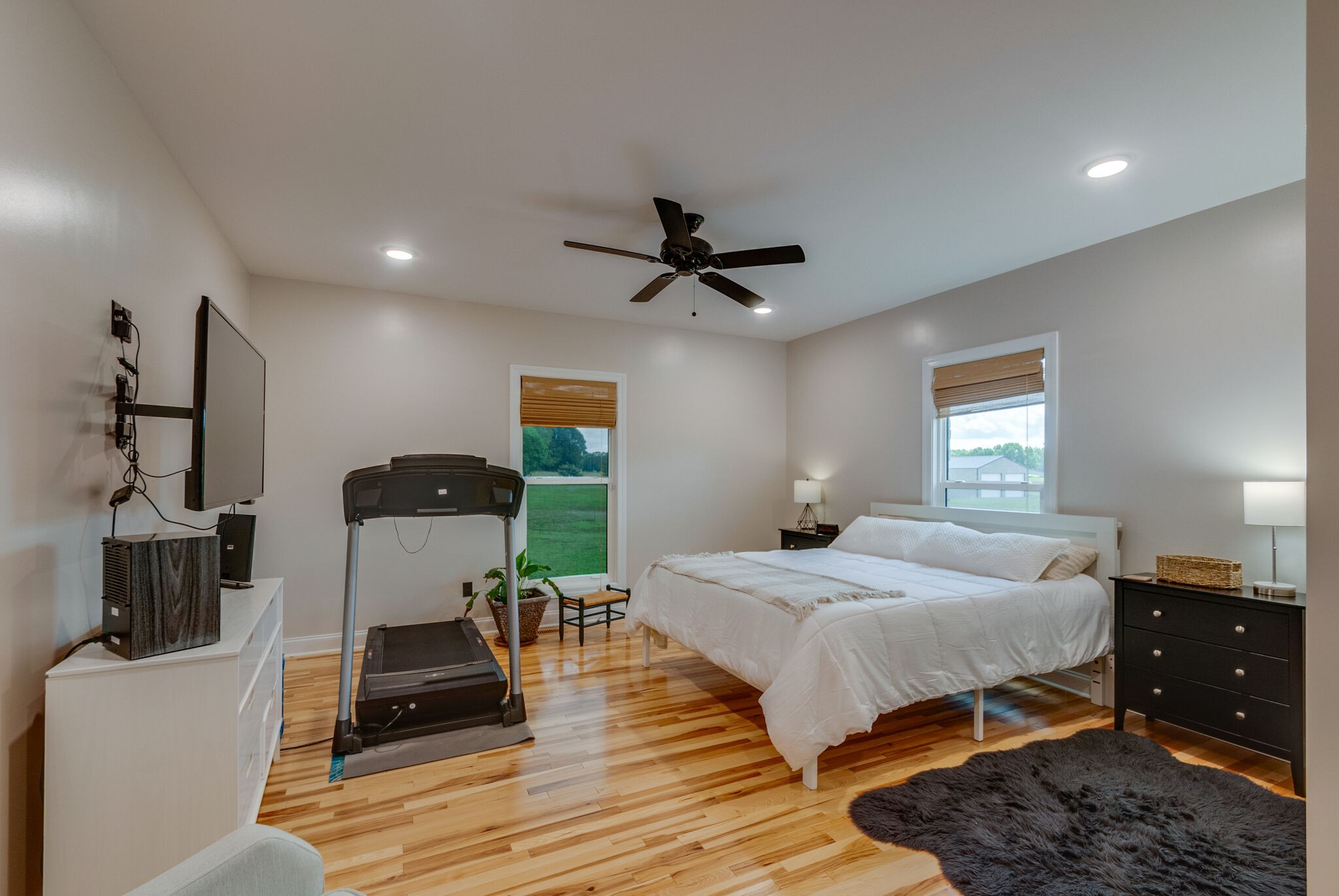32090 Ardmore Ridge Road Ardmore, TN 38449 - Photo 15 of 38 a bedroom with a bed and wooden floor