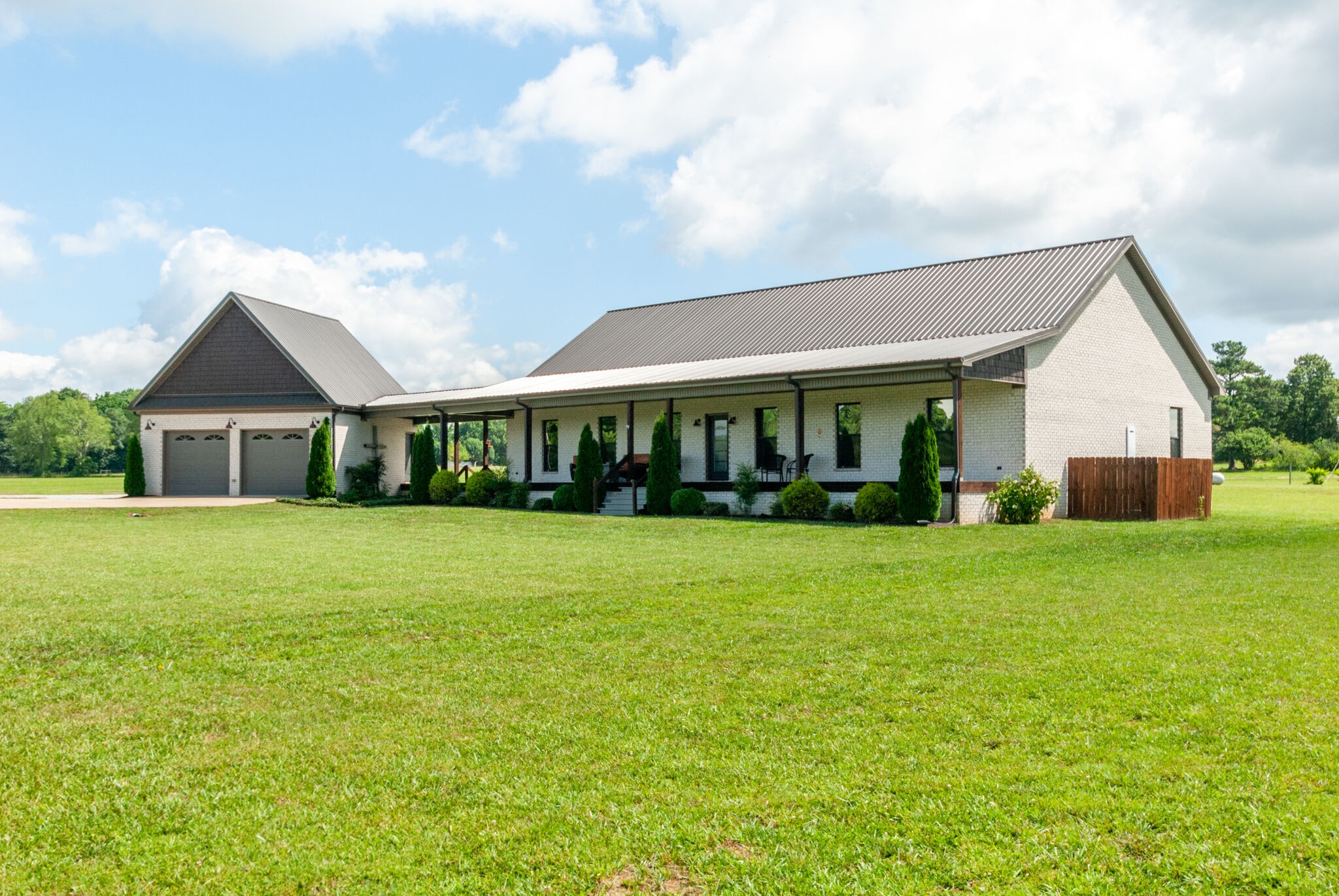 32090 Ardmore Ridge Road Ardmore, TN 38449 - Photo 2 of 38 a front view of a house with a garden