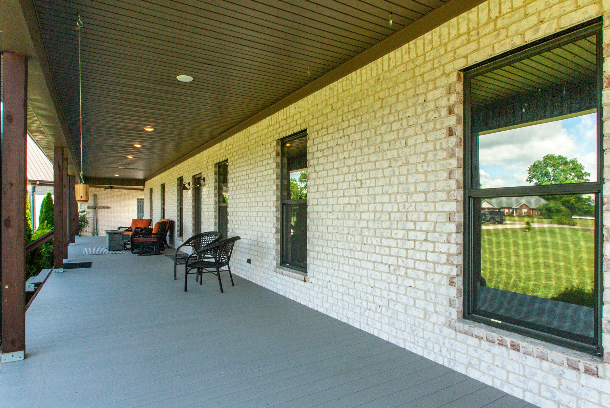 32090 Ardmore Ridge Road Ardmore, TN 38449 - Photo 6 of 38 a view of a patio with table and chairs and potted plants