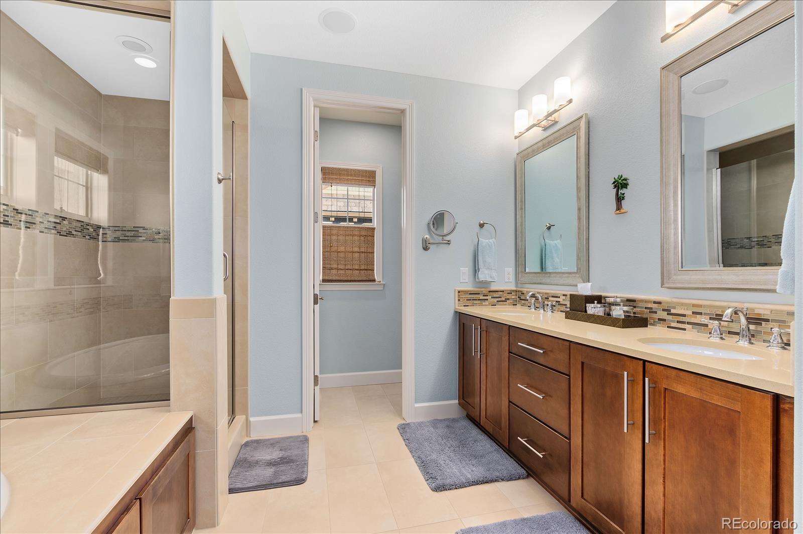 10654 Sundial Rim Road Highlands Ranch, CO 80126 - Photo 16 of 40 a bathroom with a sink and a mirror