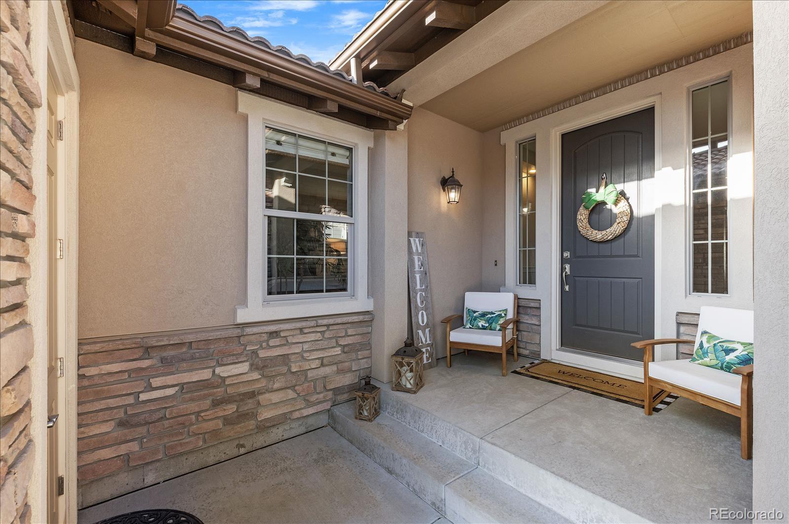 10654 Sundial Rim Road Highlands Ranch, CO 80126 - Photo 2 of 40 a view of outdoor space with porch and outdoor seating