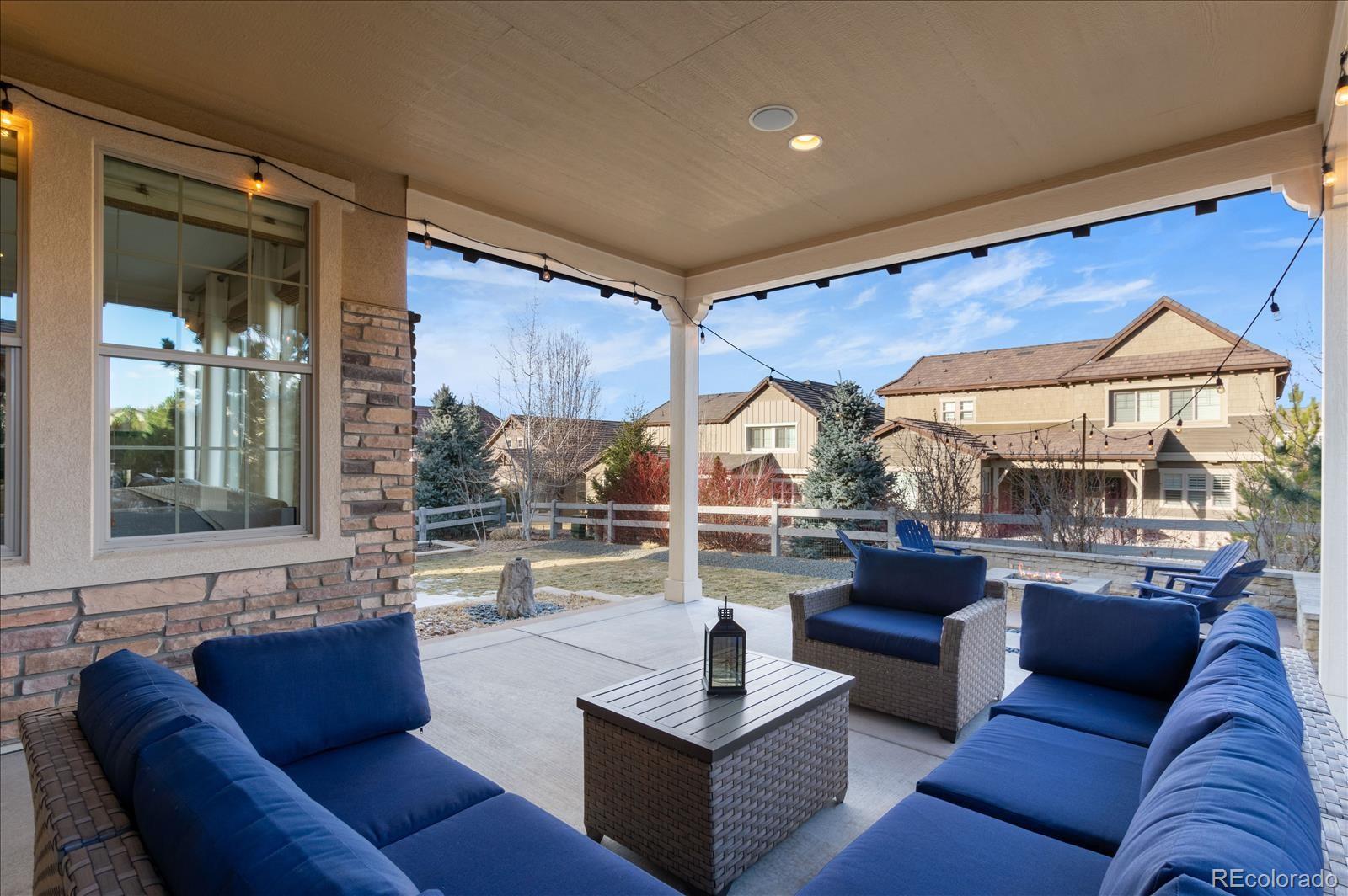 10654 Sundial Rim Road Highlands Ranch, CO 80126 - Photo 33 of 40 a living room with furniture and a large window