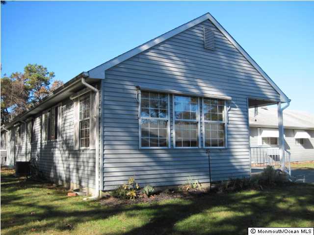 20C Alpine Road, Unit D Whiting, NJ 08759 - Photo 1 of 3 a view of house with yard